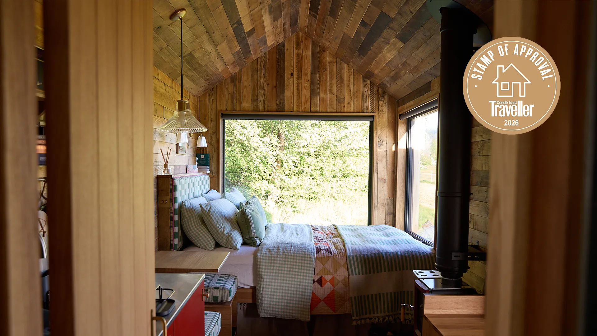 Cotswolds cabin surrounded by verdant English landscape with secluded outdoor sauna deck